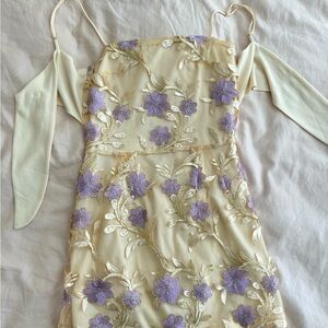 Purple flowers, yellow dress